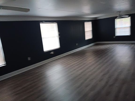 Large room that can be a 4th bedroom with sitting area. Has its own entrance from the front porch