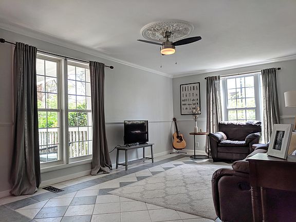 Oversized living room with ample natural light