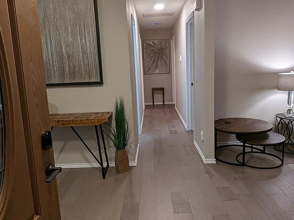 View from front door, master and 2nd bedrooms down the hallway