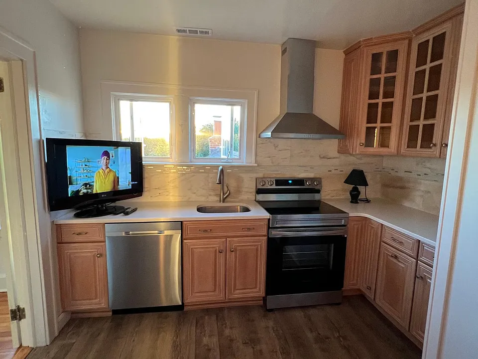 Kitchen with brand new appliances, plenty of cabinet and countertop space, and lots of natural light and sunset views
