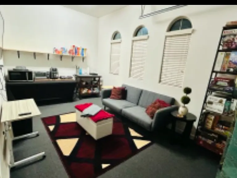 Den with included Netflix and Hulu, food storage, two hot plates, microwave, toaster + oven, air fryer, array of dishes, couch that folds out into a full sized bed, and board games.