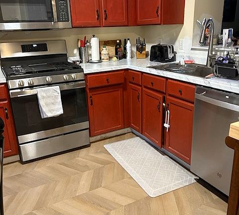 Kitchen - please note kitchen cabinets and kitchen walls will be repainted prior to move in.
