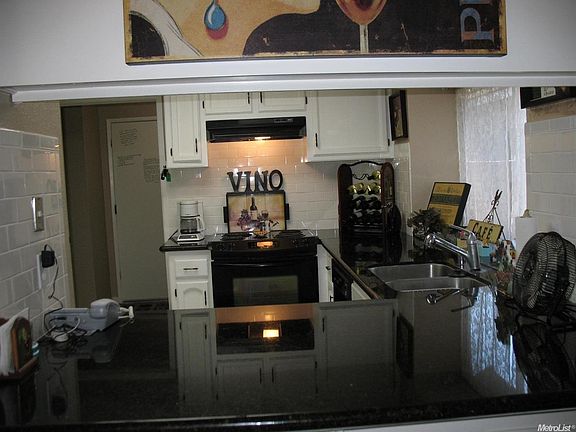 A garden window at the sink provides a great spot to grow herbs for your cooking...the utility room is between the kitchen and garage.  It has room for an extra refrigerator or pantry shelving.
