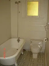 cast iron soaking tub w/shower overhead