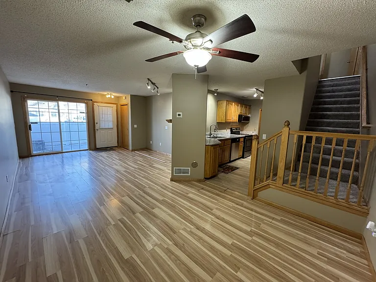View from Dining showing full living, kitchen and stairs