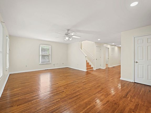 Another perspective of the spacious living room, highlighting its open layout