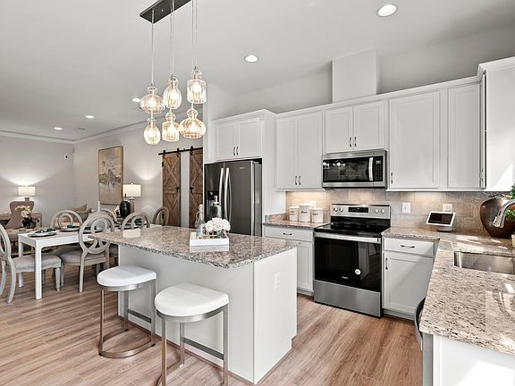 The kitchen in the Versailles model at The Crest at Linton Hall by Brookfield Residential