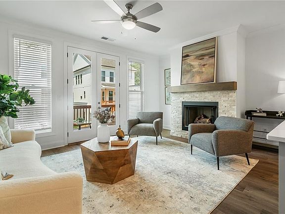 The light-filled family room, accentuated by a gas-burning fireplace, offers the perfect setting for