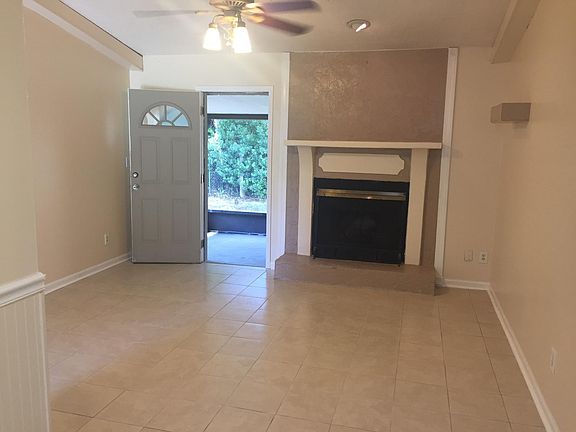 Back door leading to lanai and private fenced yard