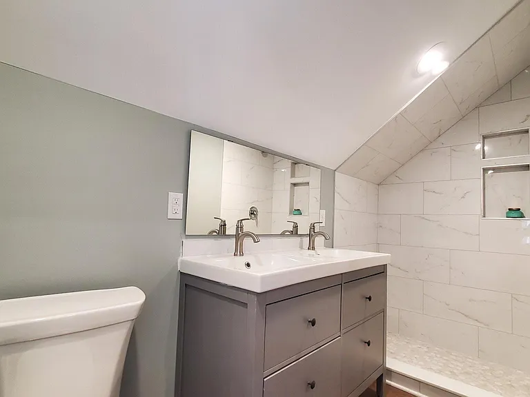 3rd floor bathroom with double vanity and walk in shower