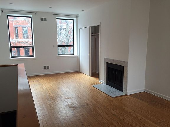 living room (stairwell to entry visible on left)