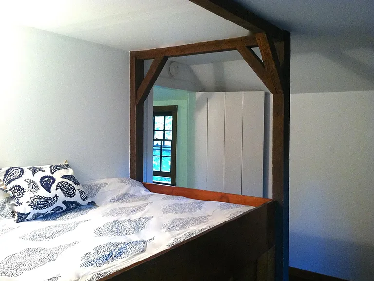 Original hand hewn (almost) full size built in bed perfect for a guest or child with new futon for your use.