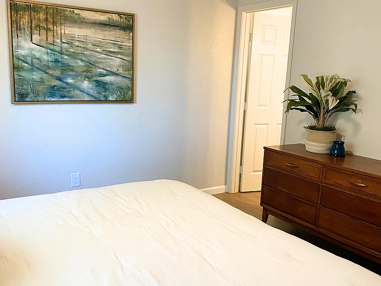 Spacious Master Bedroom with a stylish dresser & a private ensuite bathroom for your convenience.