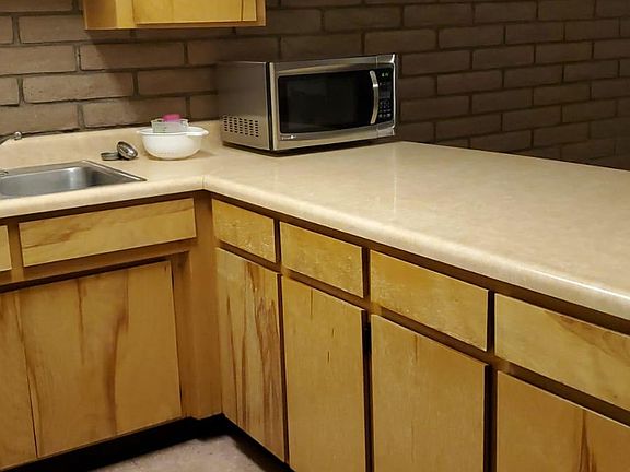 Roomy Kitchen cabinets and a nice large microwave