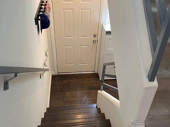 Stairs to Front door from Living room