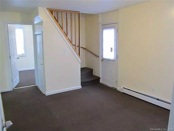 Living room and stirs to bedrooms