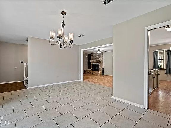 Dining room looking into kitchen and living room