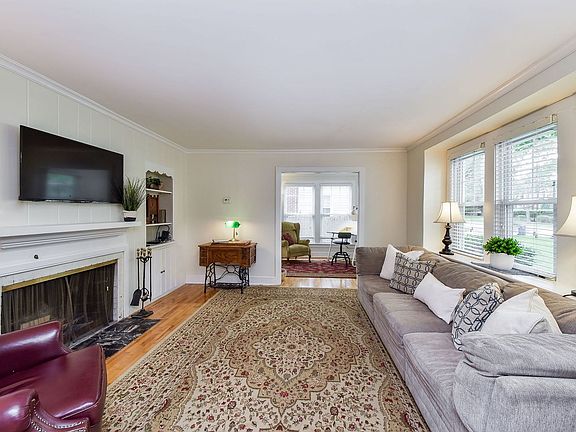 Living room with wood burning fireplace