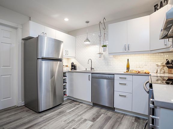 Fully equipped kitchen with plates, glassware, utensils, etc.