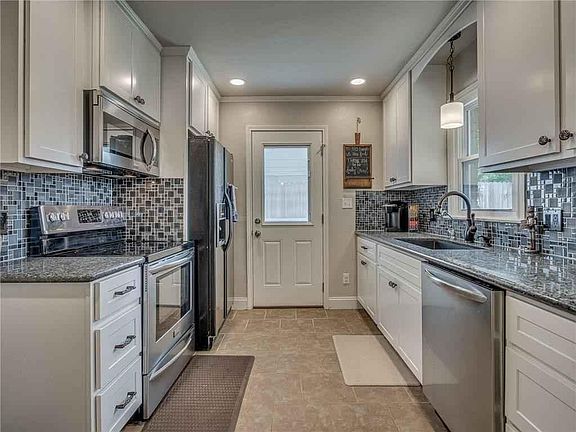 New kitchen cabinets, granite countertops, tile, sink, faucets, and all new appliances, including refrigerator and microwave!