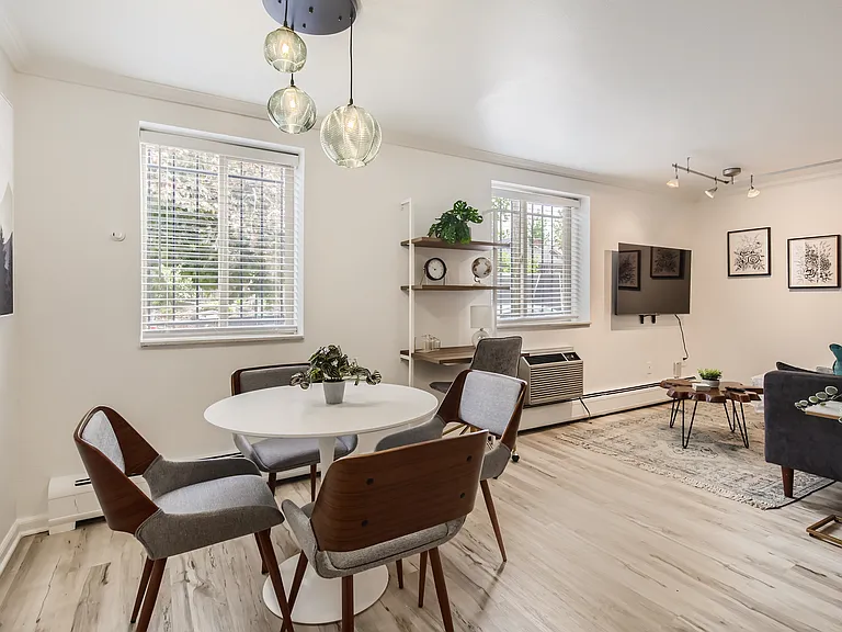 The bright and airy open concept dining and living area features brand-new, stylish furnishings and ample lighting throughout the space. Work from home at the dedicated workspace, the dining table, or the kitchen bar top for a standing option!