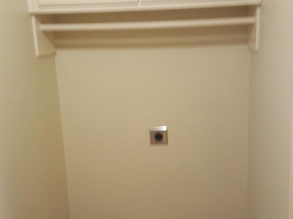 Dryer hookup and storage above!