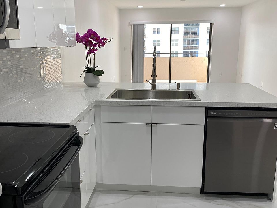Kitchen View to Living Room and Balcony