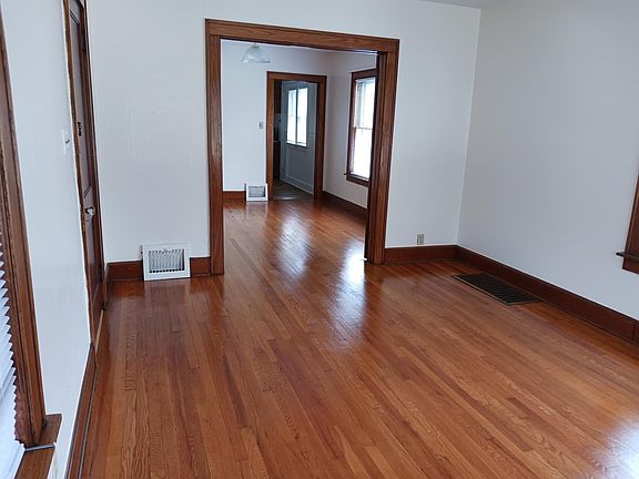 Another view of the living room - all beautiful hard wood floors and woodwork throughout.
