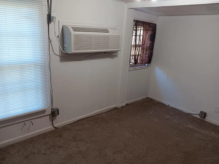 Living room with new PTAC unit