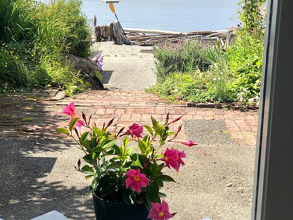 Your path to the lower larger patio, beach yard, tidelands and walkable Fauntleroy Cove beaches.