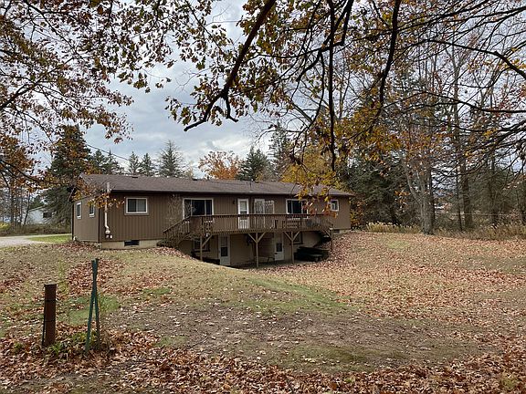Rear deck and walk out patio to the river and firepit.