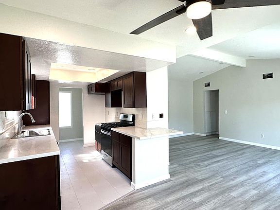 View of kitchen and living room from dining room