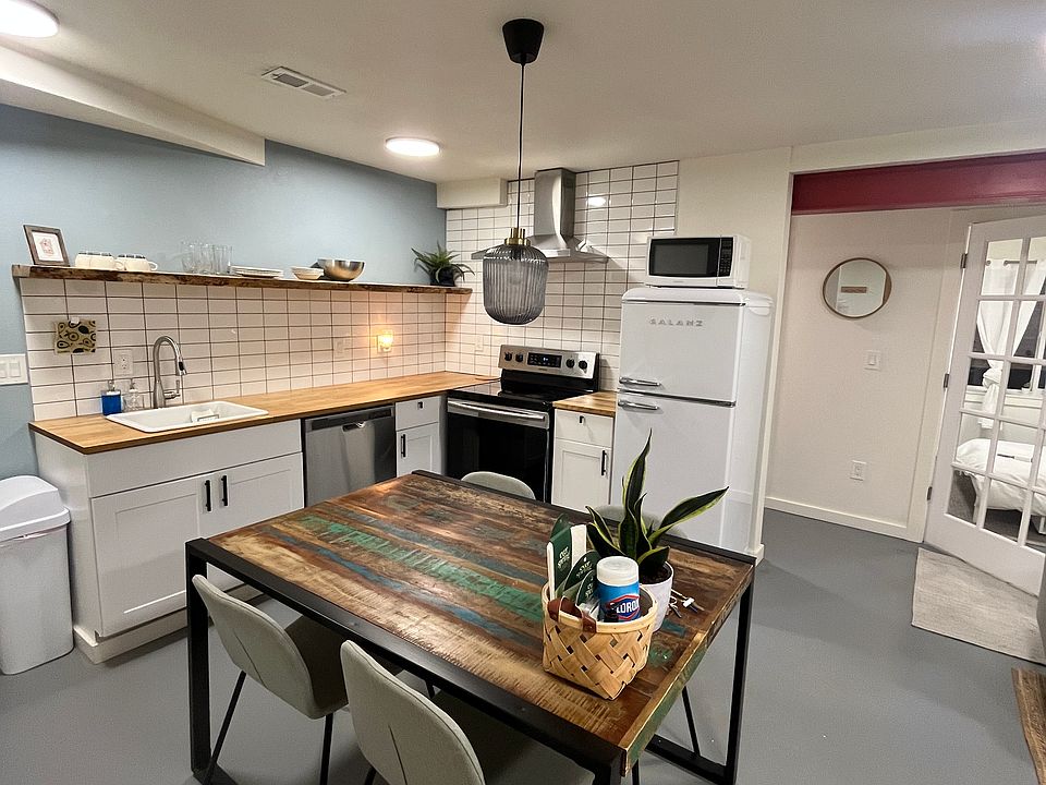 Modern kitchen with new appliances. Butcher block countertops.
