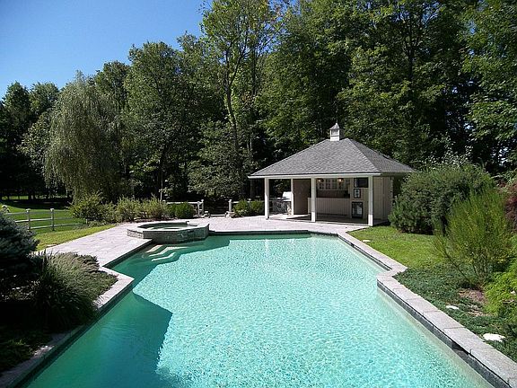 Gunite pool with a pool house