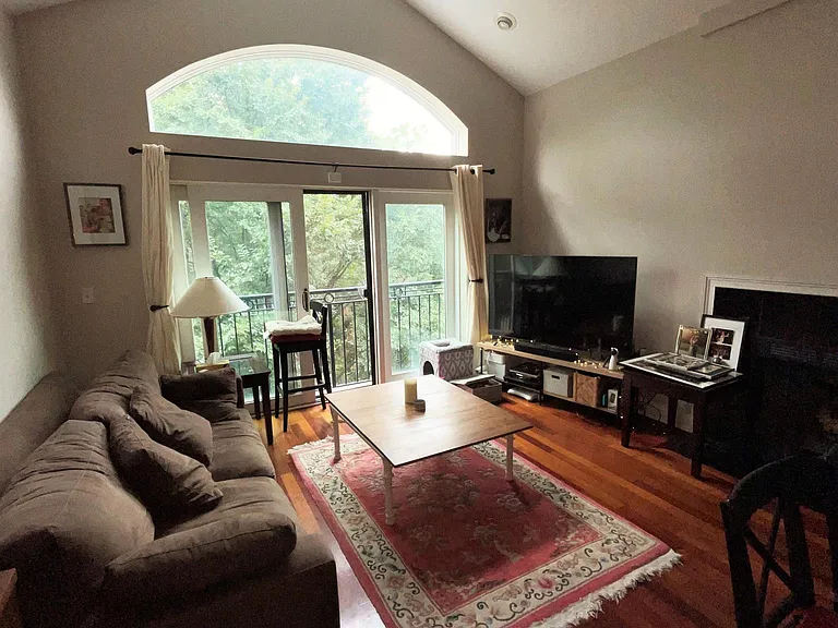 Living room with cathedral ceiling, recessed lighting, non-obstructed view