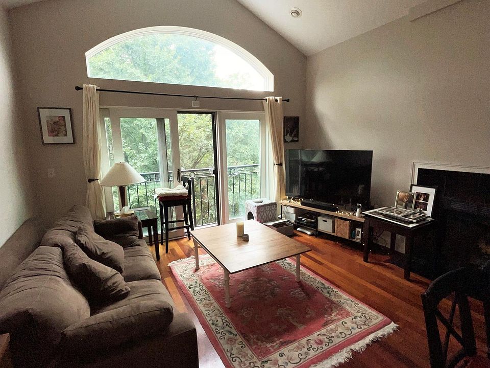 Living room with cathedral ceiling, recessed lighting, non-obstructed view