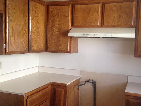 Kitchen w/ Natural Wooden Cabinets