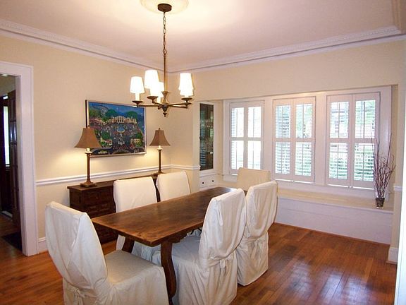 Large & elegant dining room has more built-ins and window seats