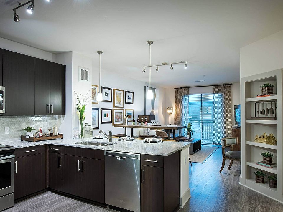 Open concept kitchen with stainless steel appliances