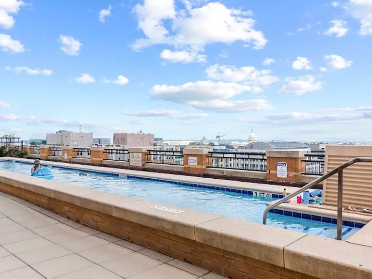 Rooftop pool with panoramic views of the DC skyline including the Capitol building and Washington Monument.