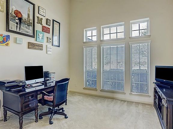 The study offers high ceiling and a wall of windows to enjoy the beautiful water view across the street.