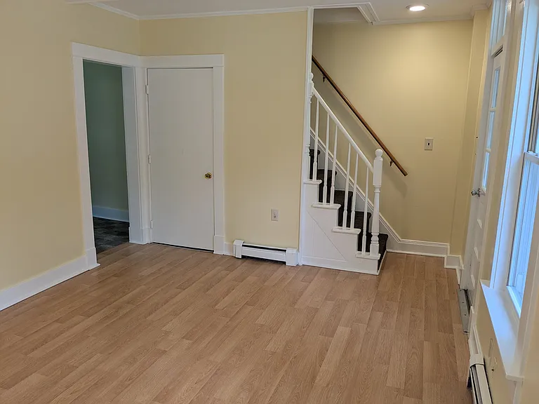 Stairs to second floor and private basement.