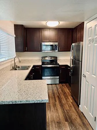 Modern, remodeled kitchen with stainless steel appliances.
