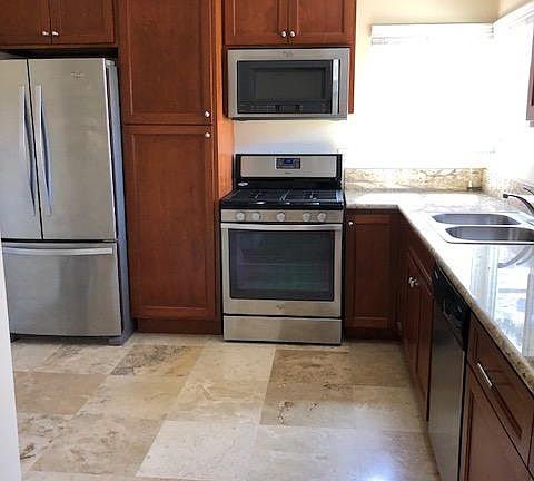 Recently renovated kitchen. Stainless steel appliances, gra