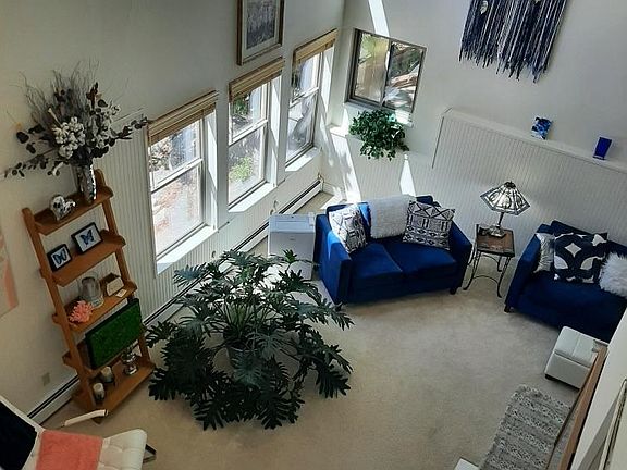 Looking down on living room from upstairs hallway