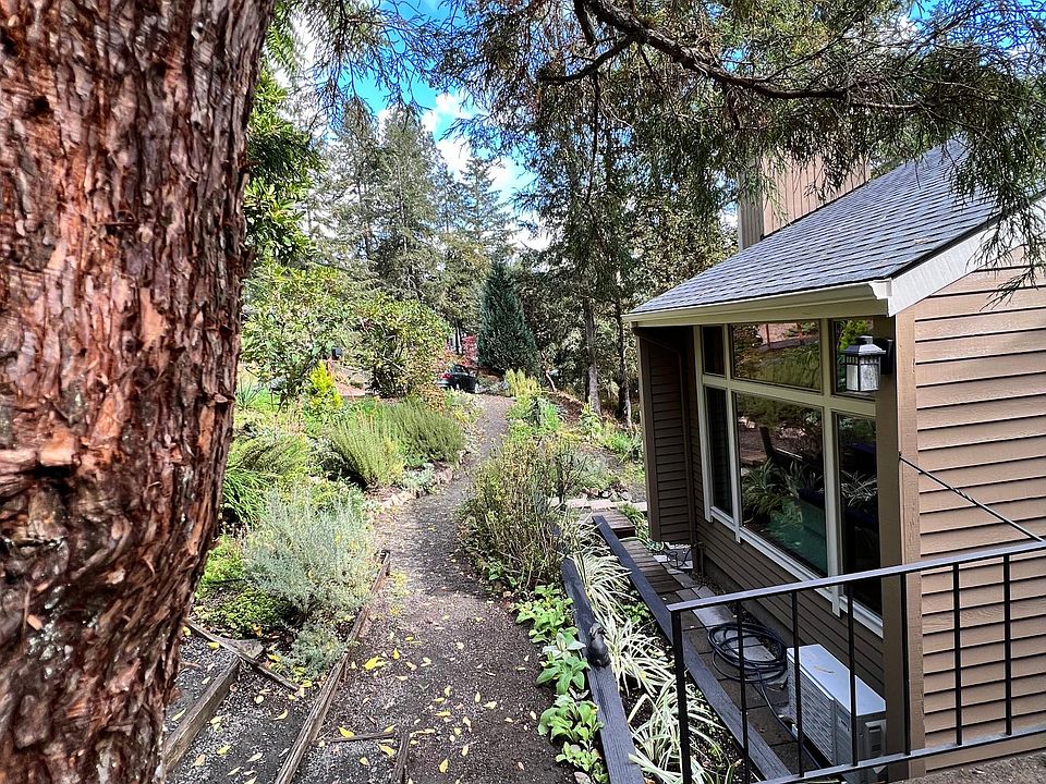 Deer trails by your front windows. Terraced flower beds have savory herbs and wildflowers.