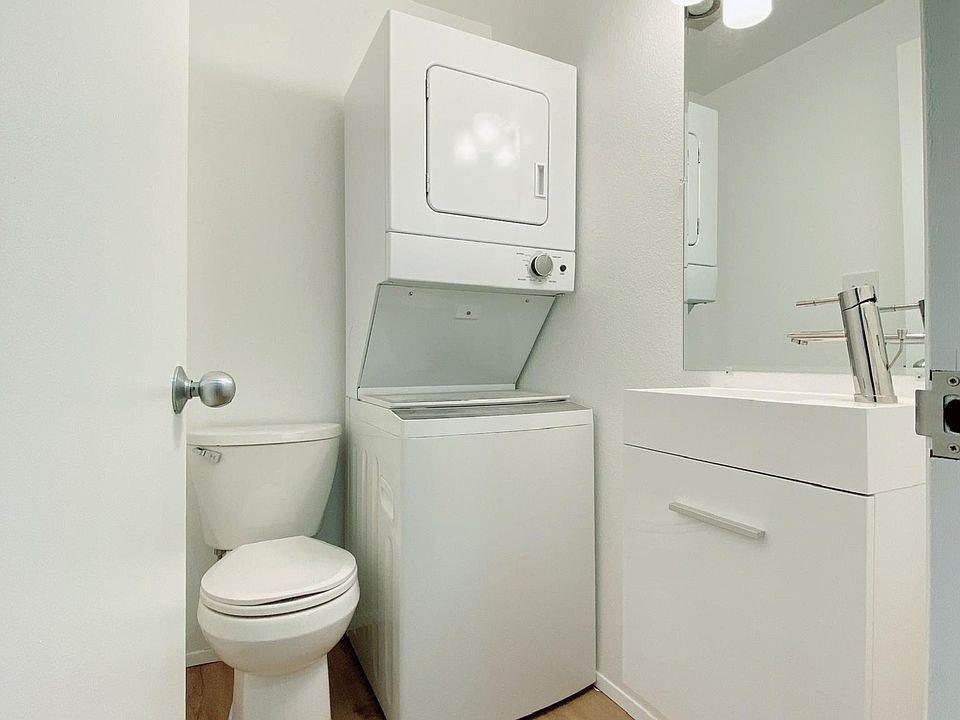 1st floor powder room (half bath) with stackable laundry machine