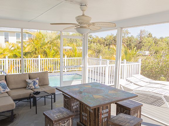 Screened porch with view of the river.