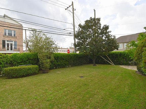 This home enjoys a huge outdoor space. The HOA has a landscaping contract that includes the mowing of the grass and trimming of the bushes for this home.