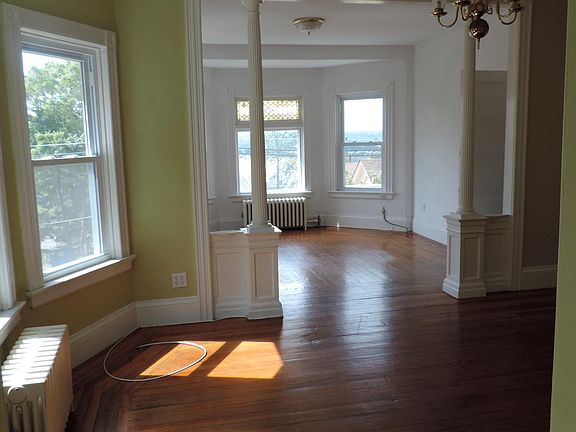 Looking from the kitchen doorway into the dining room and living room. there are 7 windows in the two rooms. The front of the house faces west for great afternoon light.